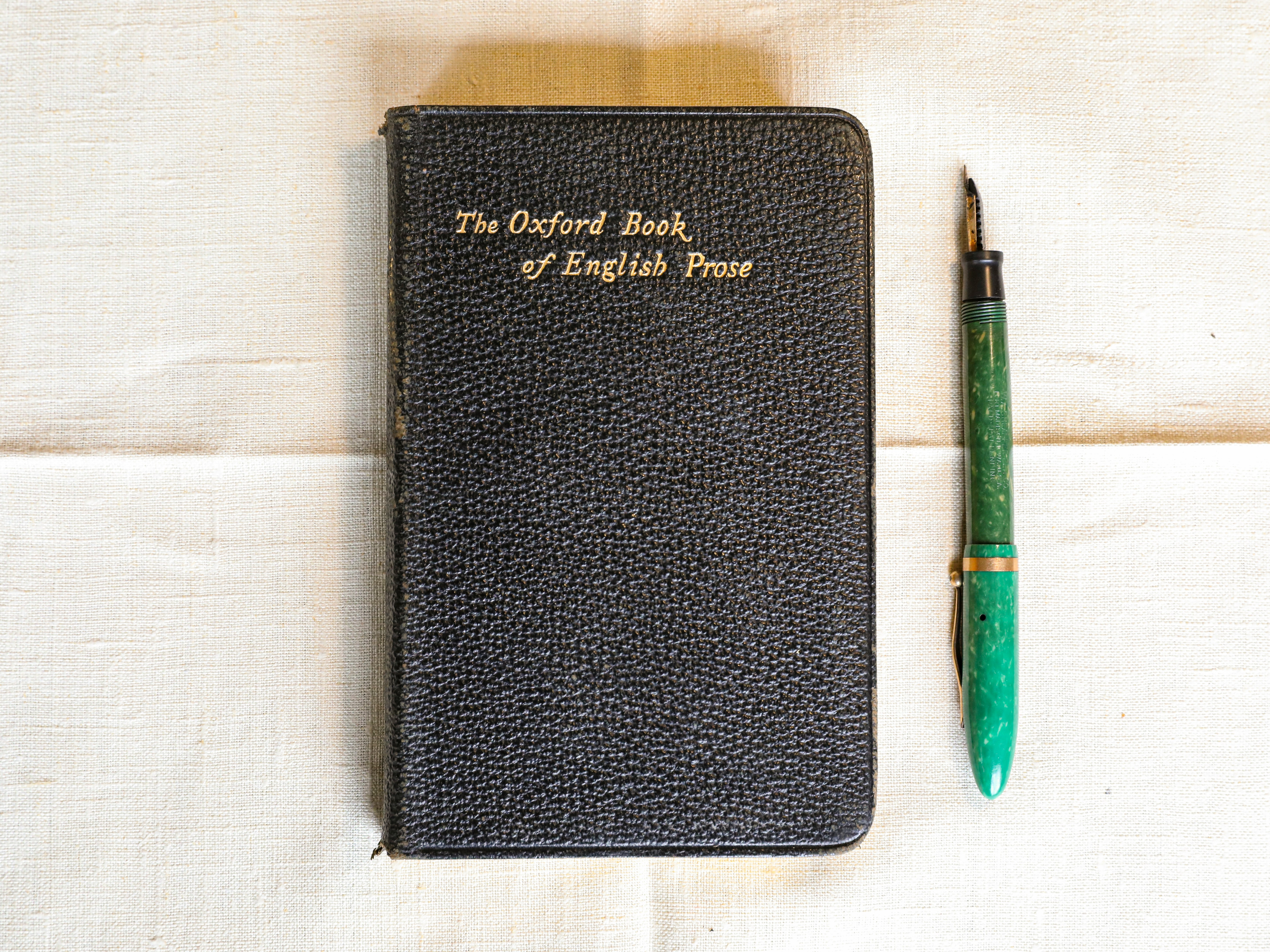 black leather case with green click pen